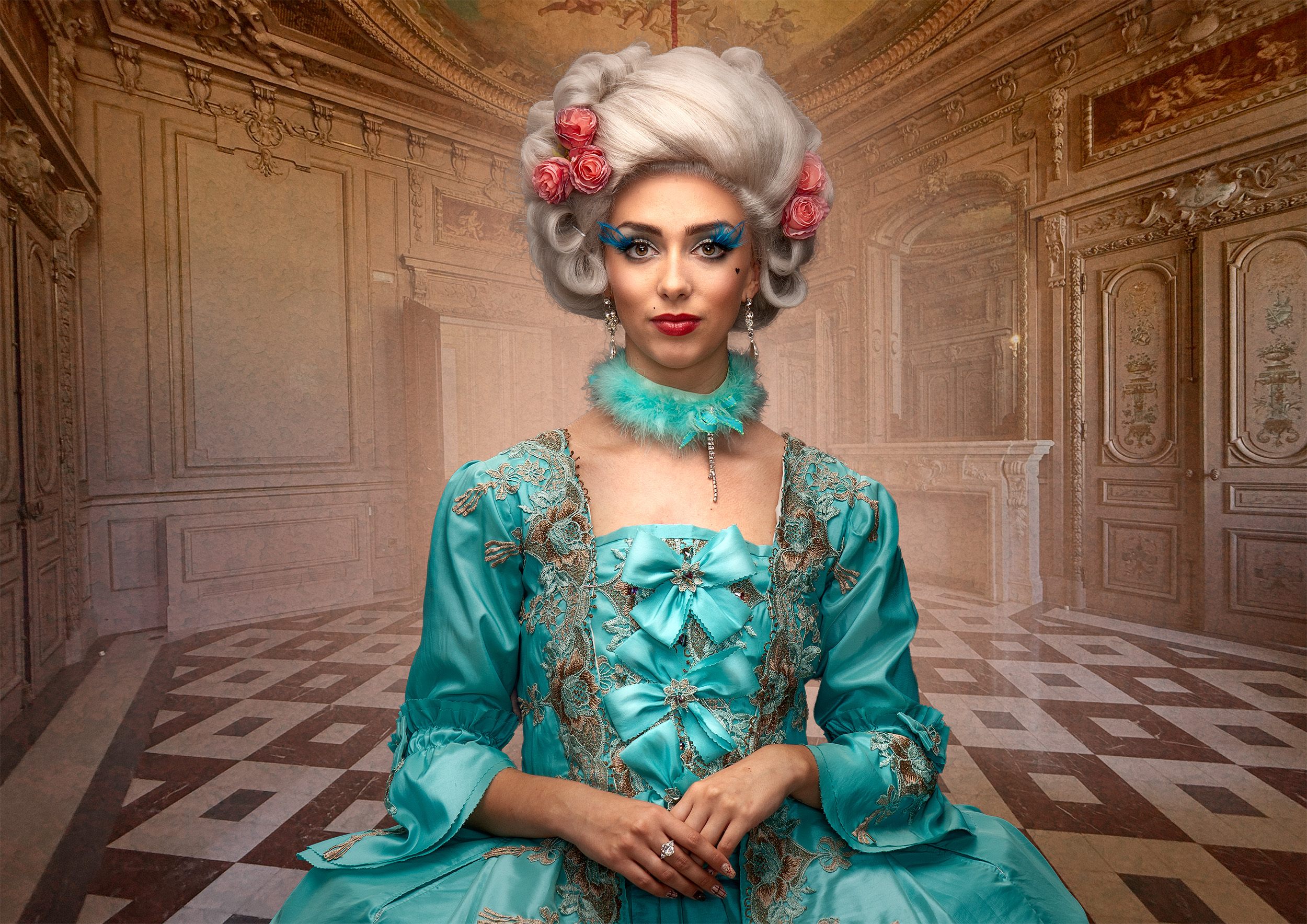 A woman in a turquoise period gown in an ornate interior